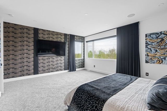 There is a large bed in the middle of the room.