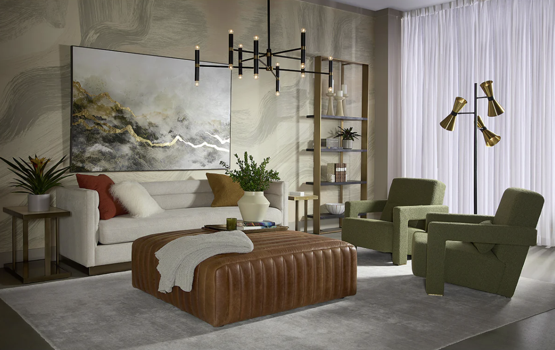 Living room with a sofa, two chairs, a large ottoman, and abstract art.