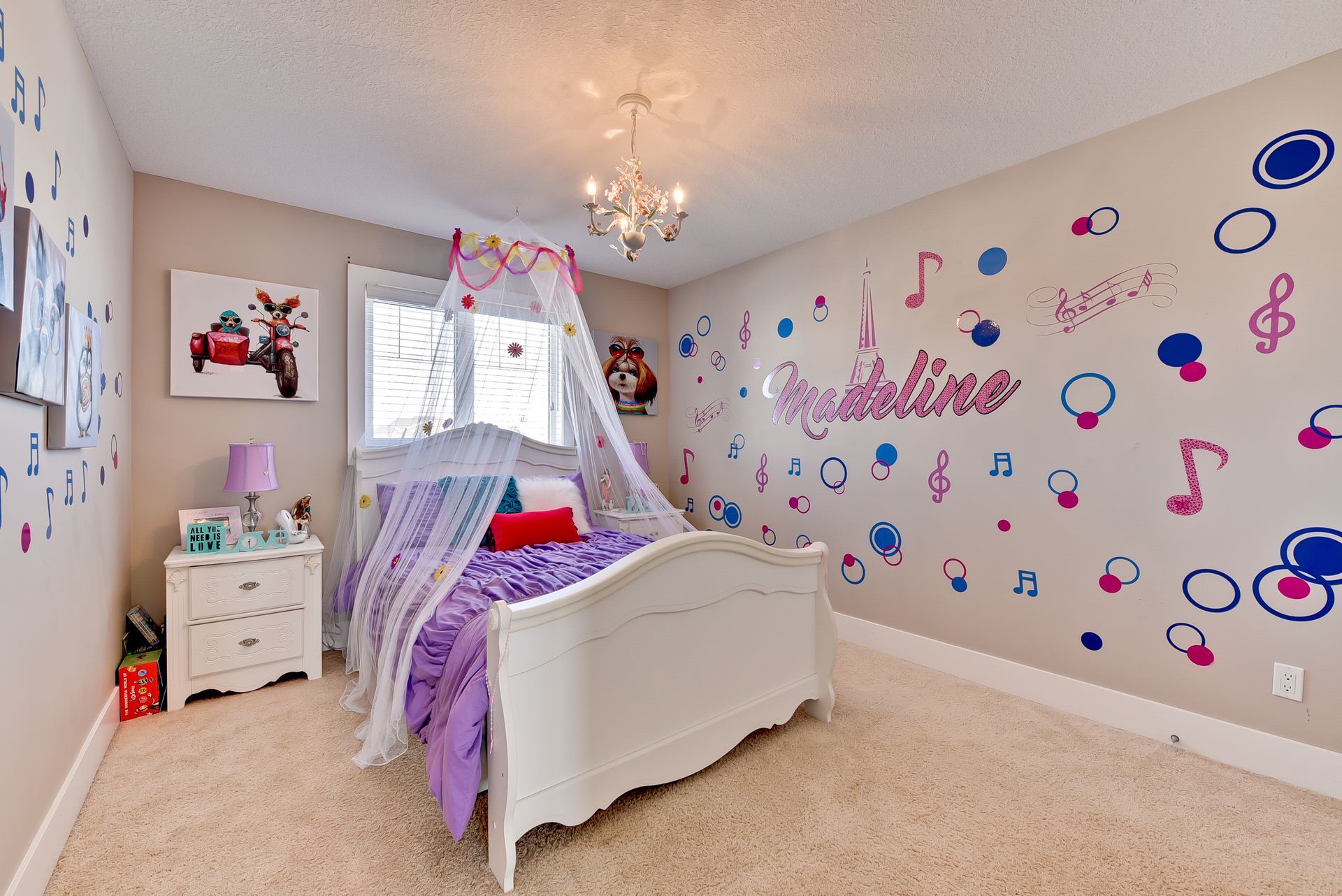 A bedroom with a bed , nightstand , and music notes on the wall.