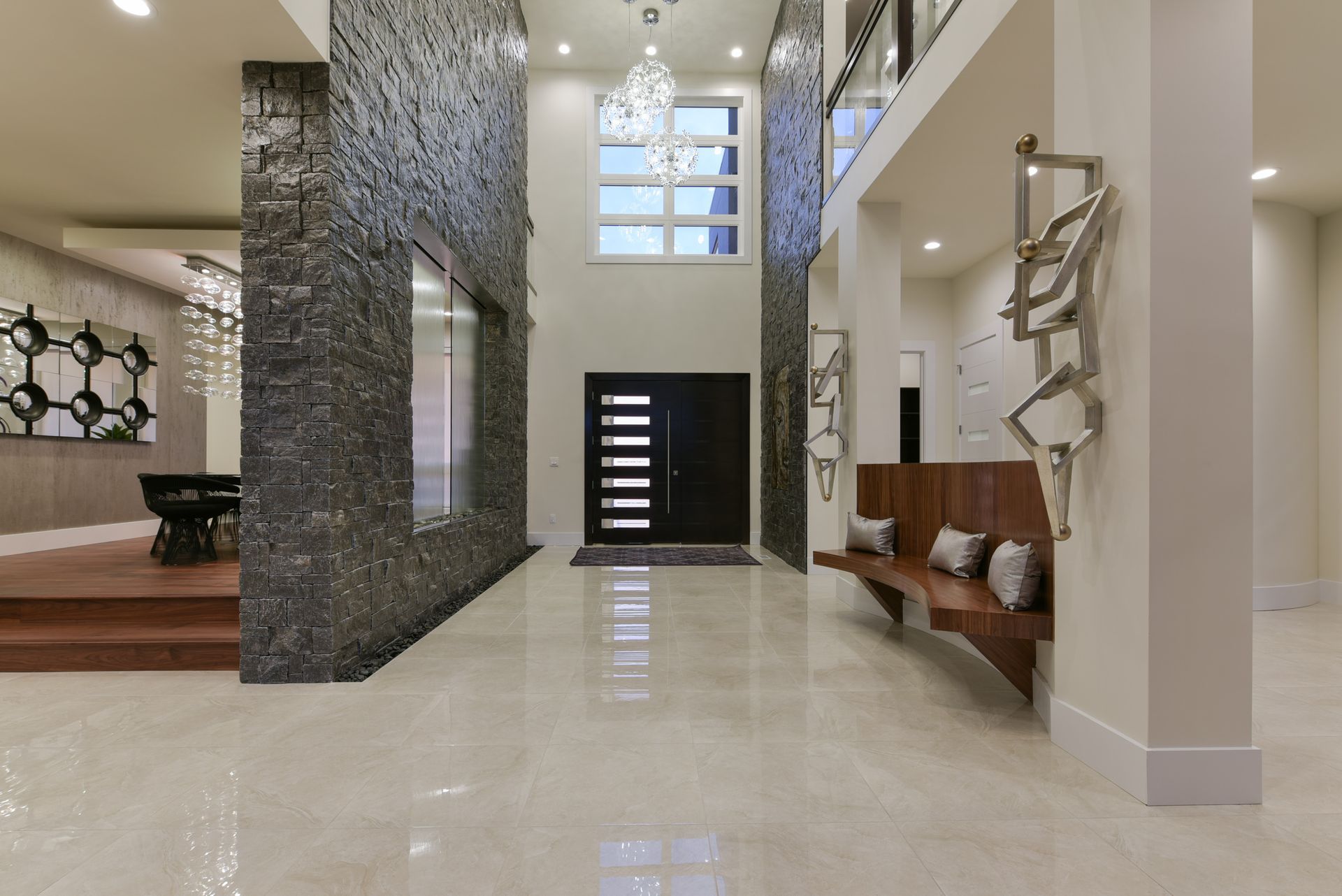 A large hallway in a house with a black door