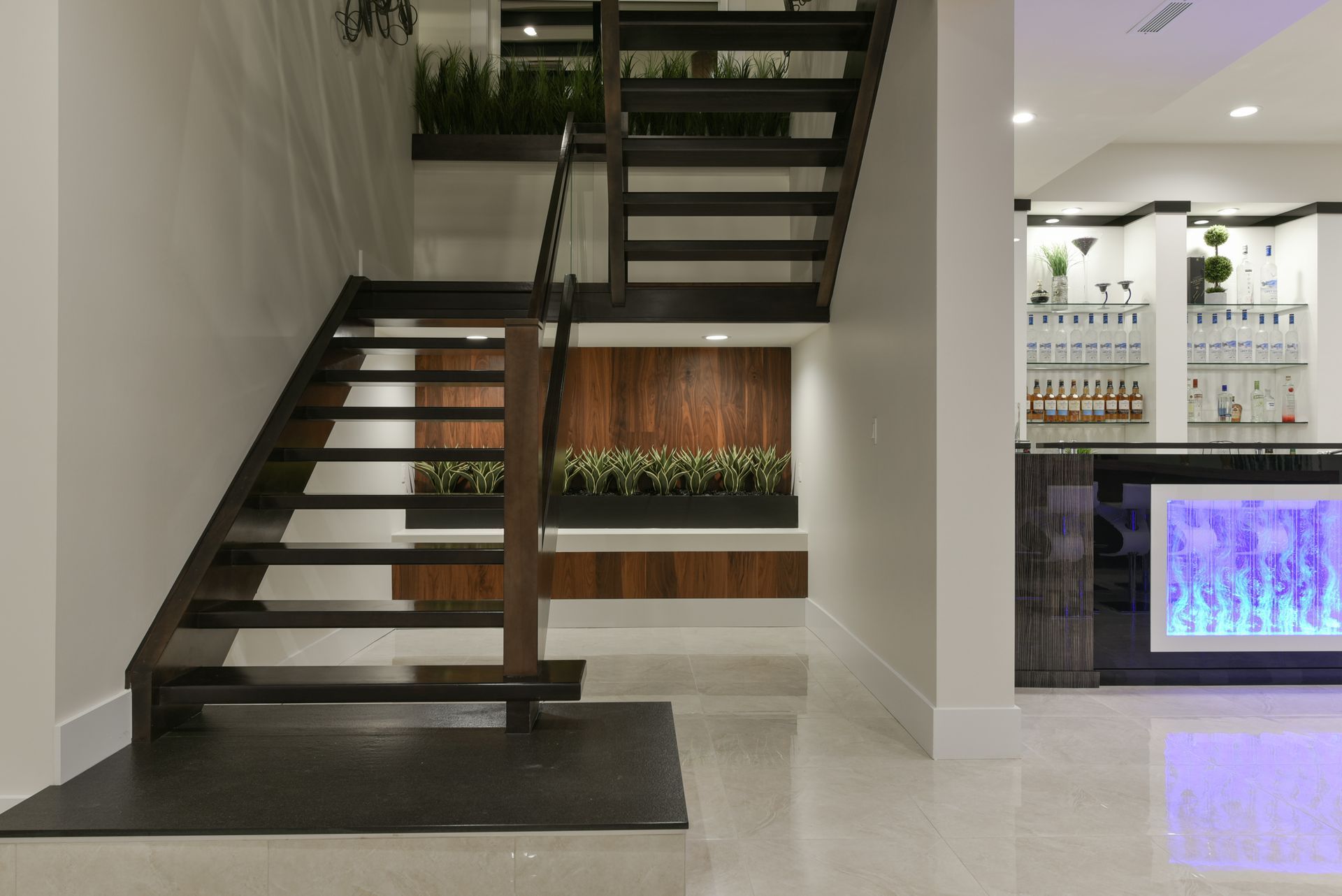 A staircase in a room with a counter in the background