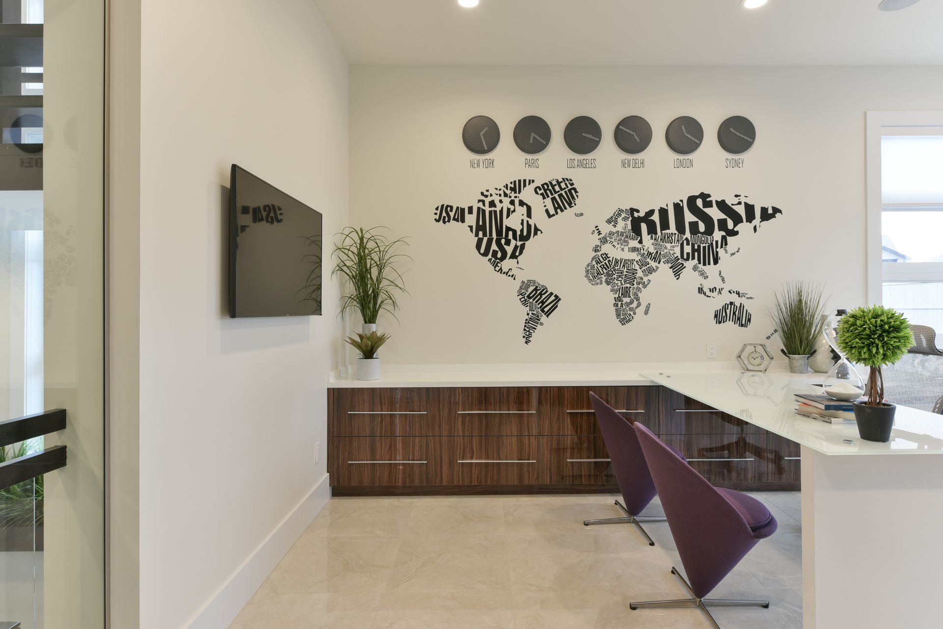 A room with a map of the world on the wall.