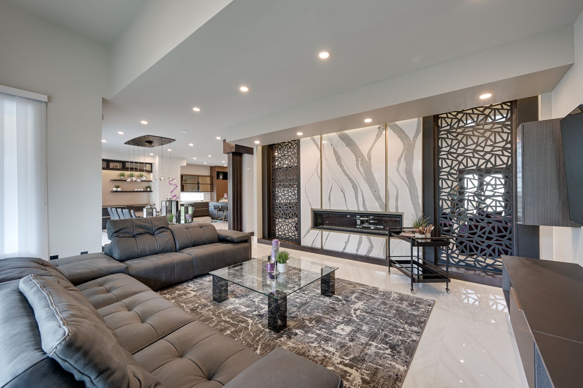 A living room with a couch , coffee table , and fireplace.