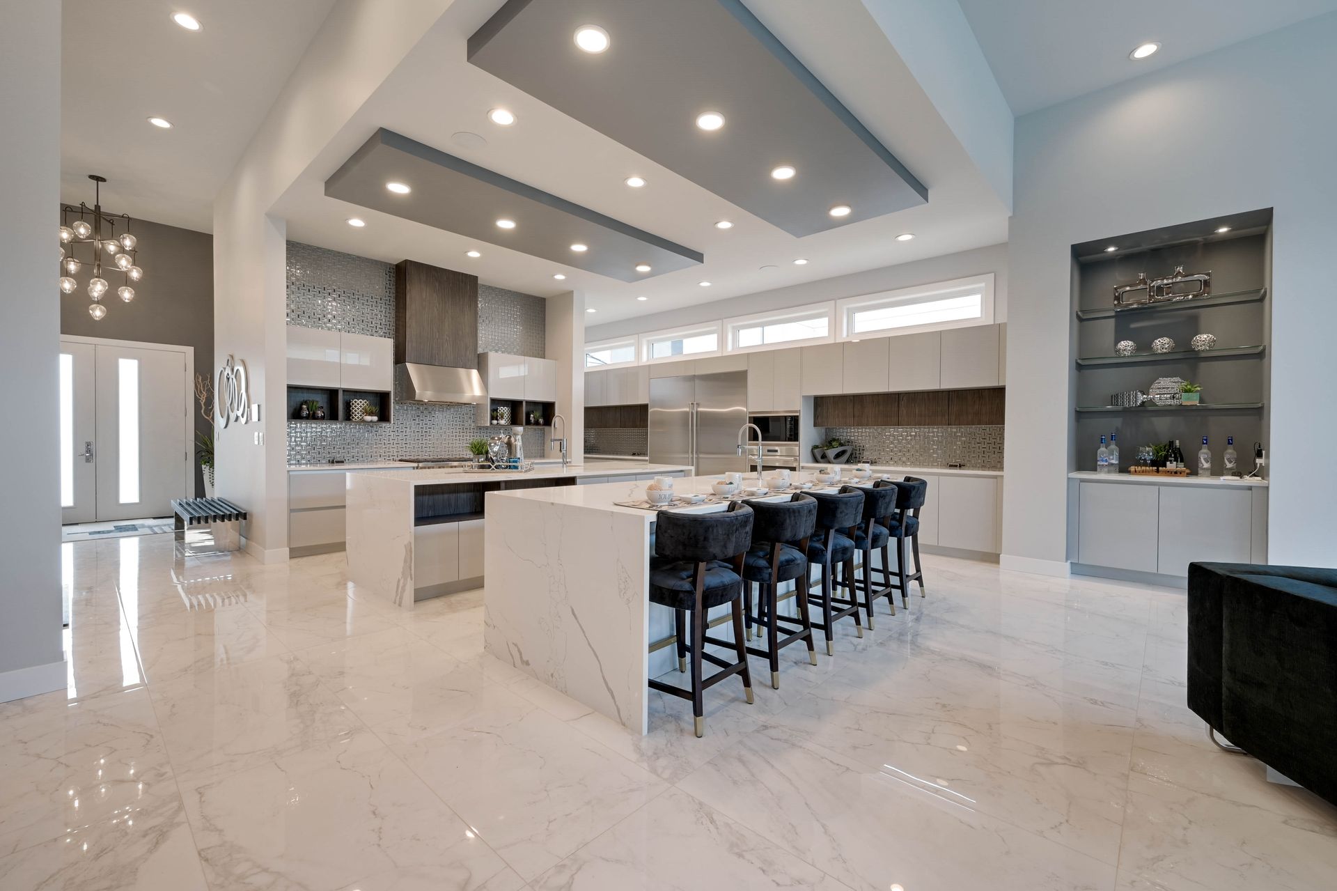 A large kitchen with a large island in the middle of the room.