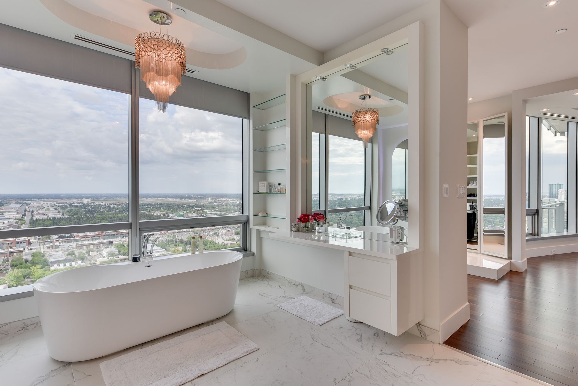 A bathroom with a bathtub and a large window