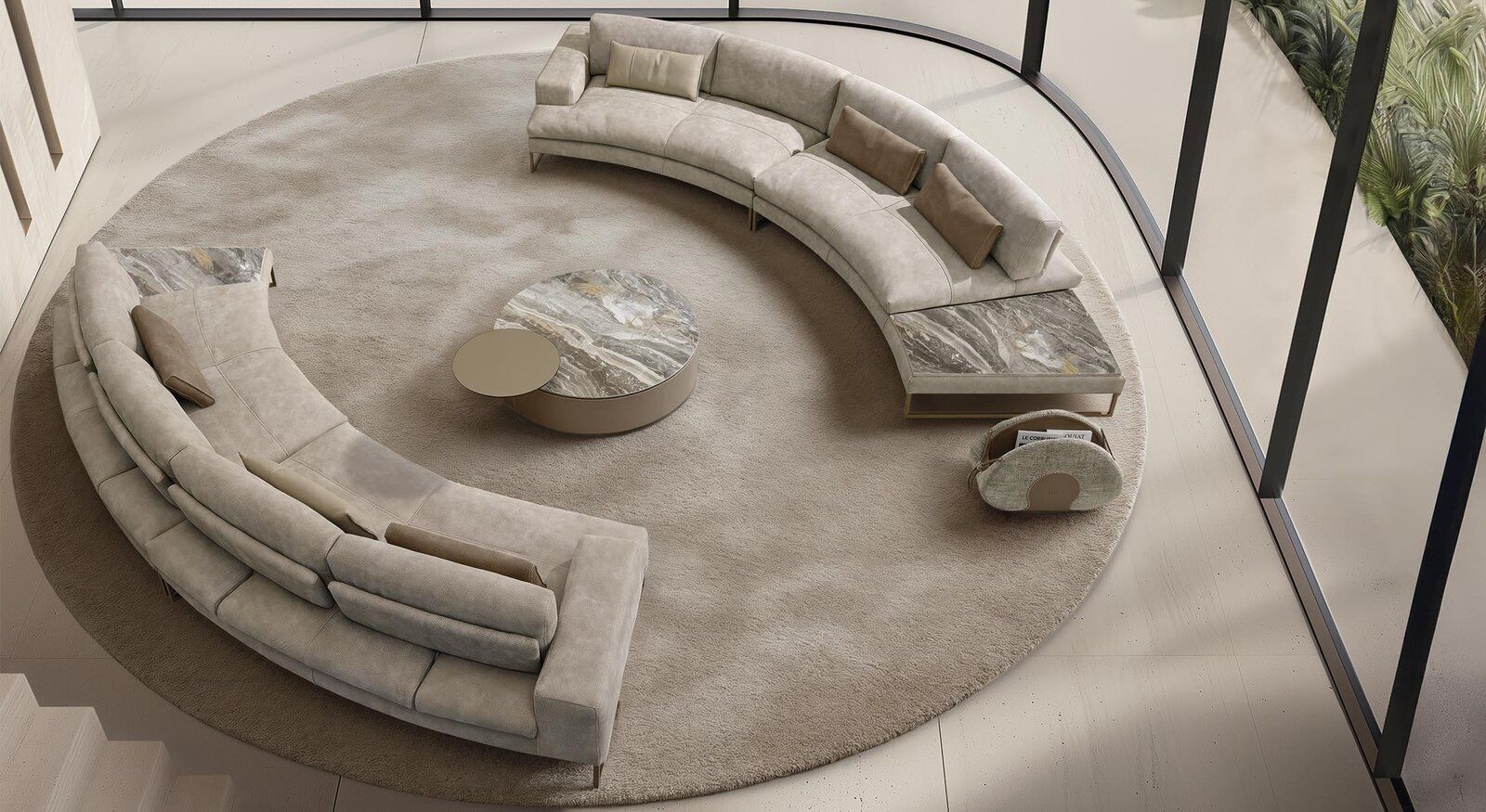 A round couch is sitting on top of a round rug in a living room.
