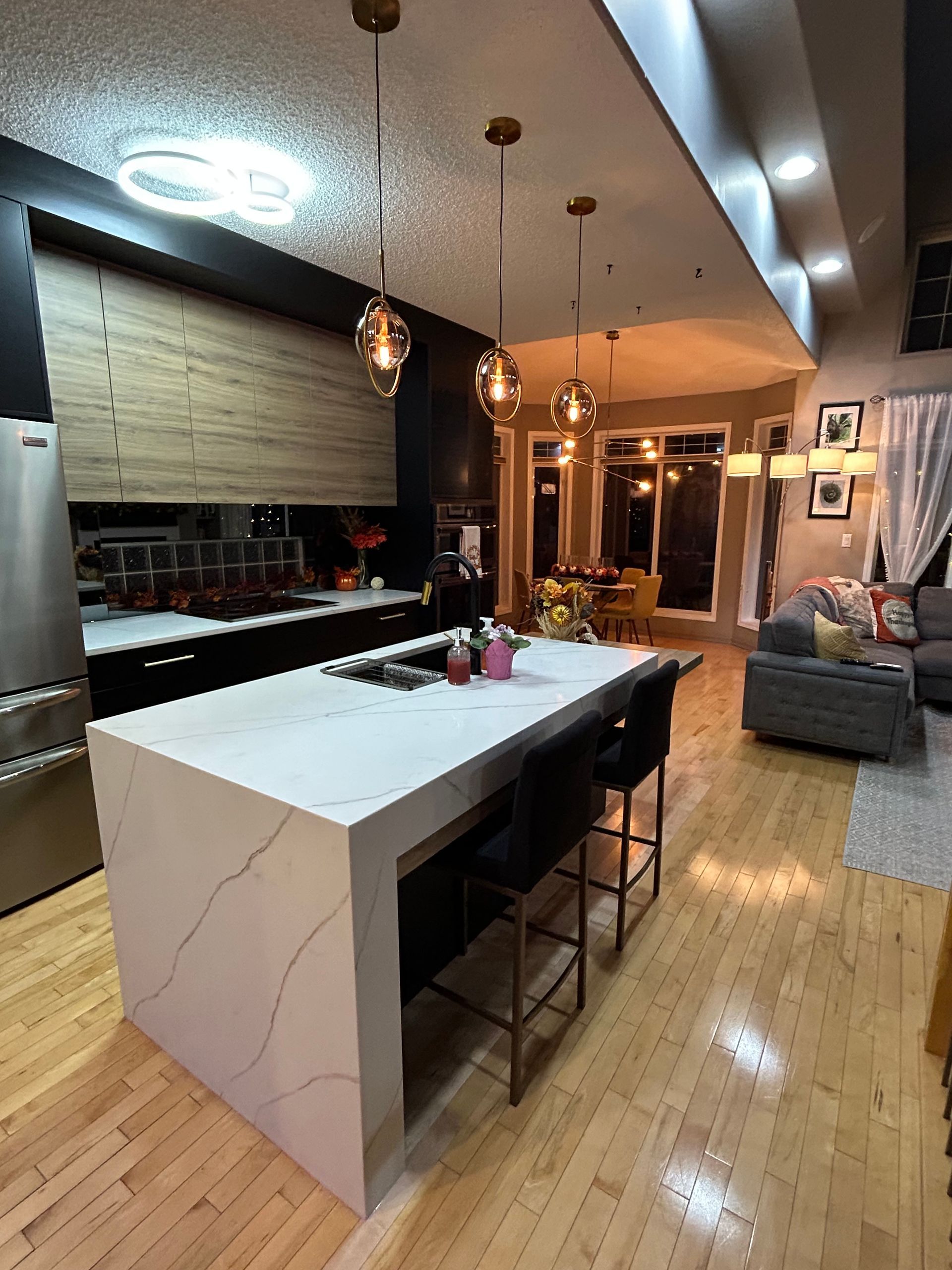 A kitchen with a large island in the middle of the room.