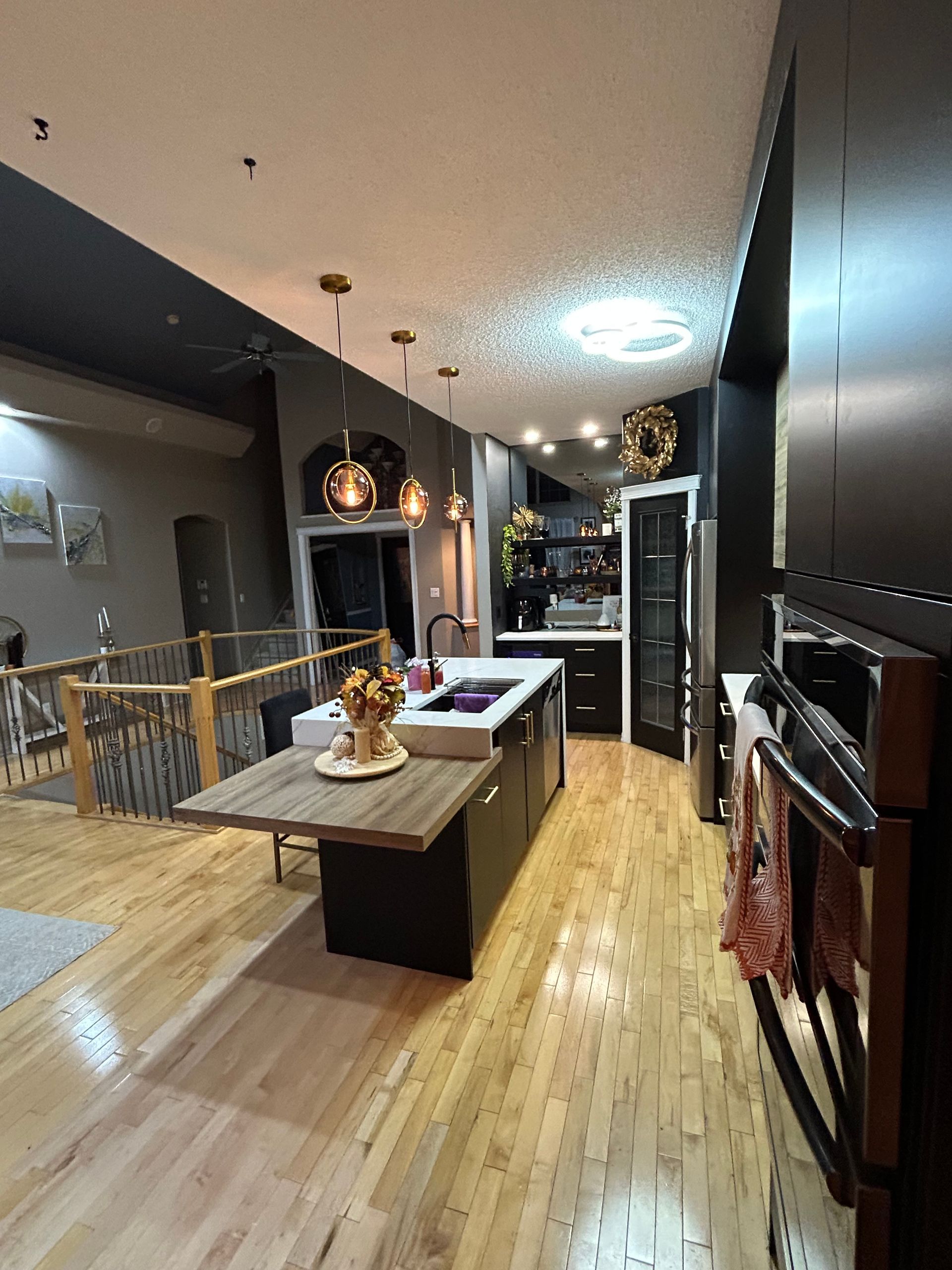 A kitchen with a large island in the middle of the room.