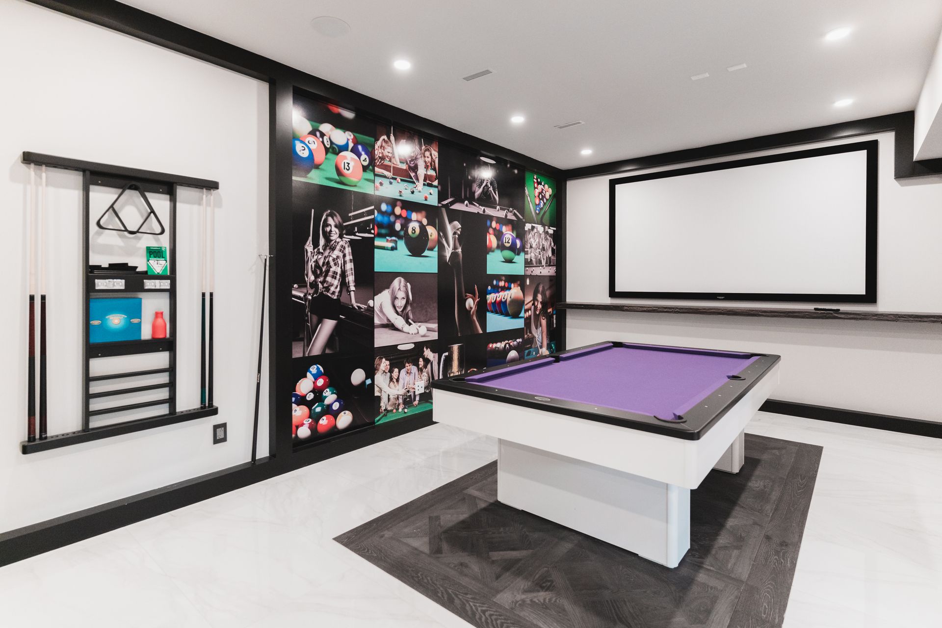 There is a pool table in the middle of the room.