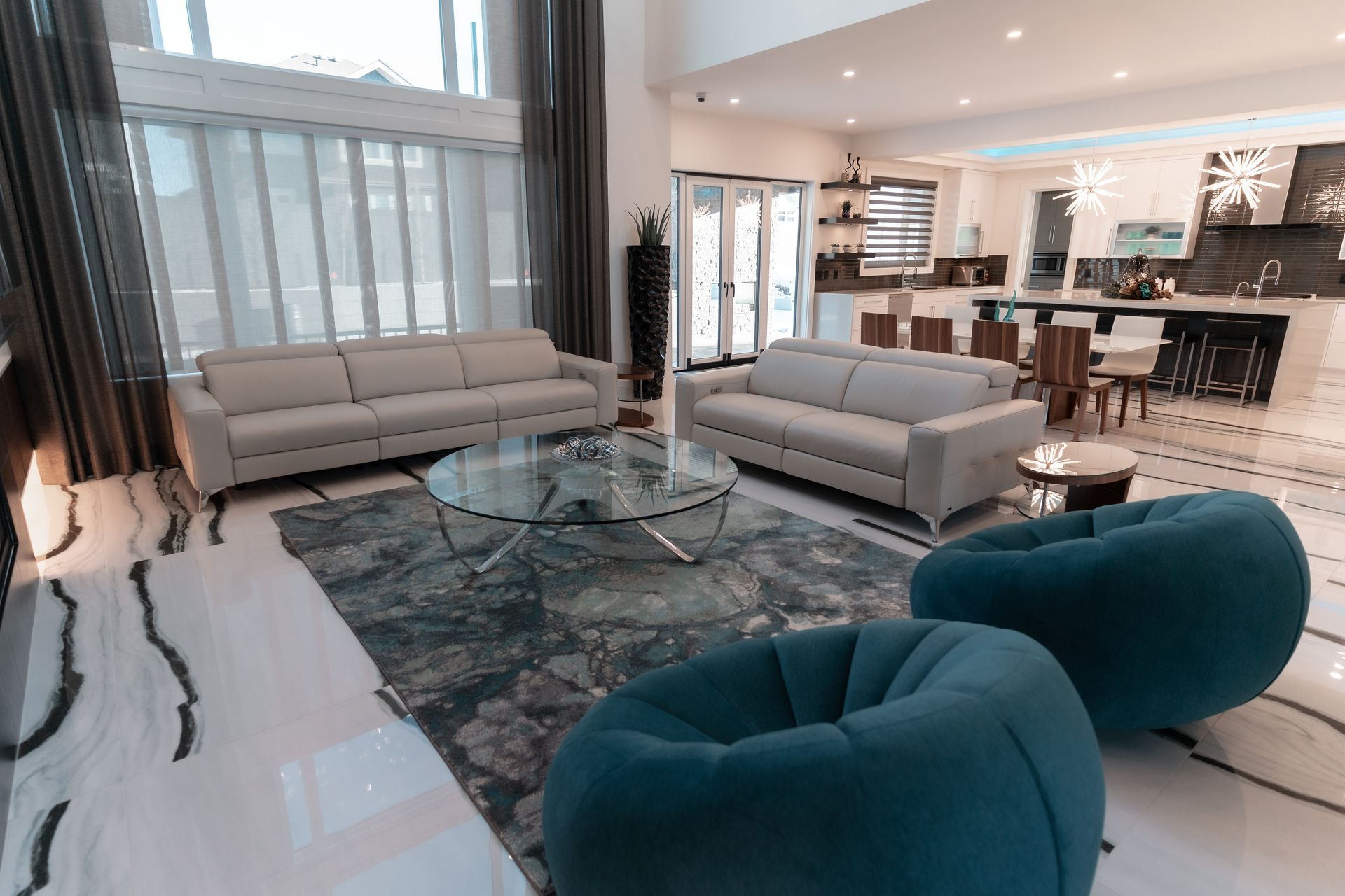 A living room filled with furniture and a glass coffee table.