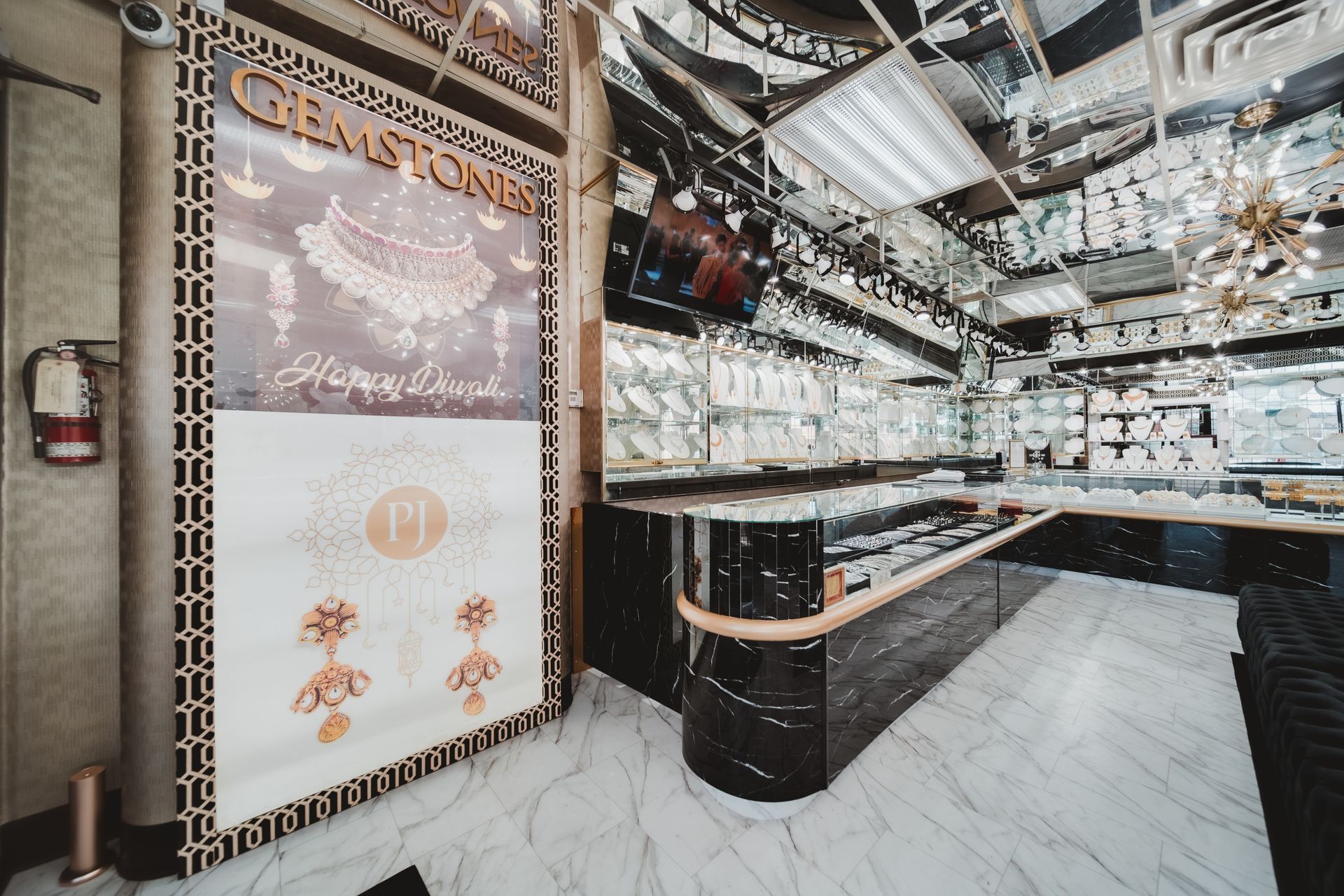 A jewelry store with a sign on the wall that says gems stones.