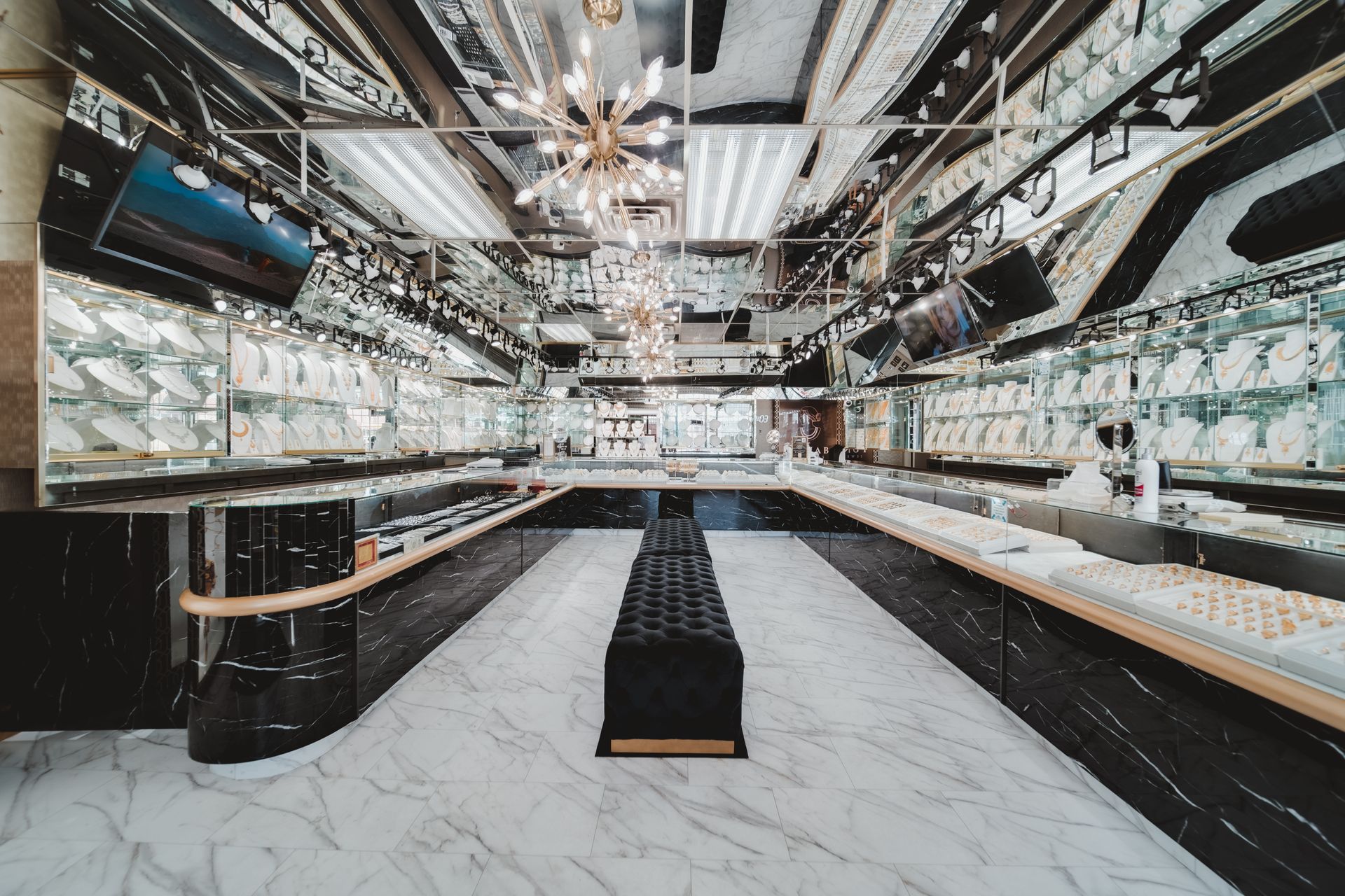 A large jewelry store with a lot of jewelry on display.
