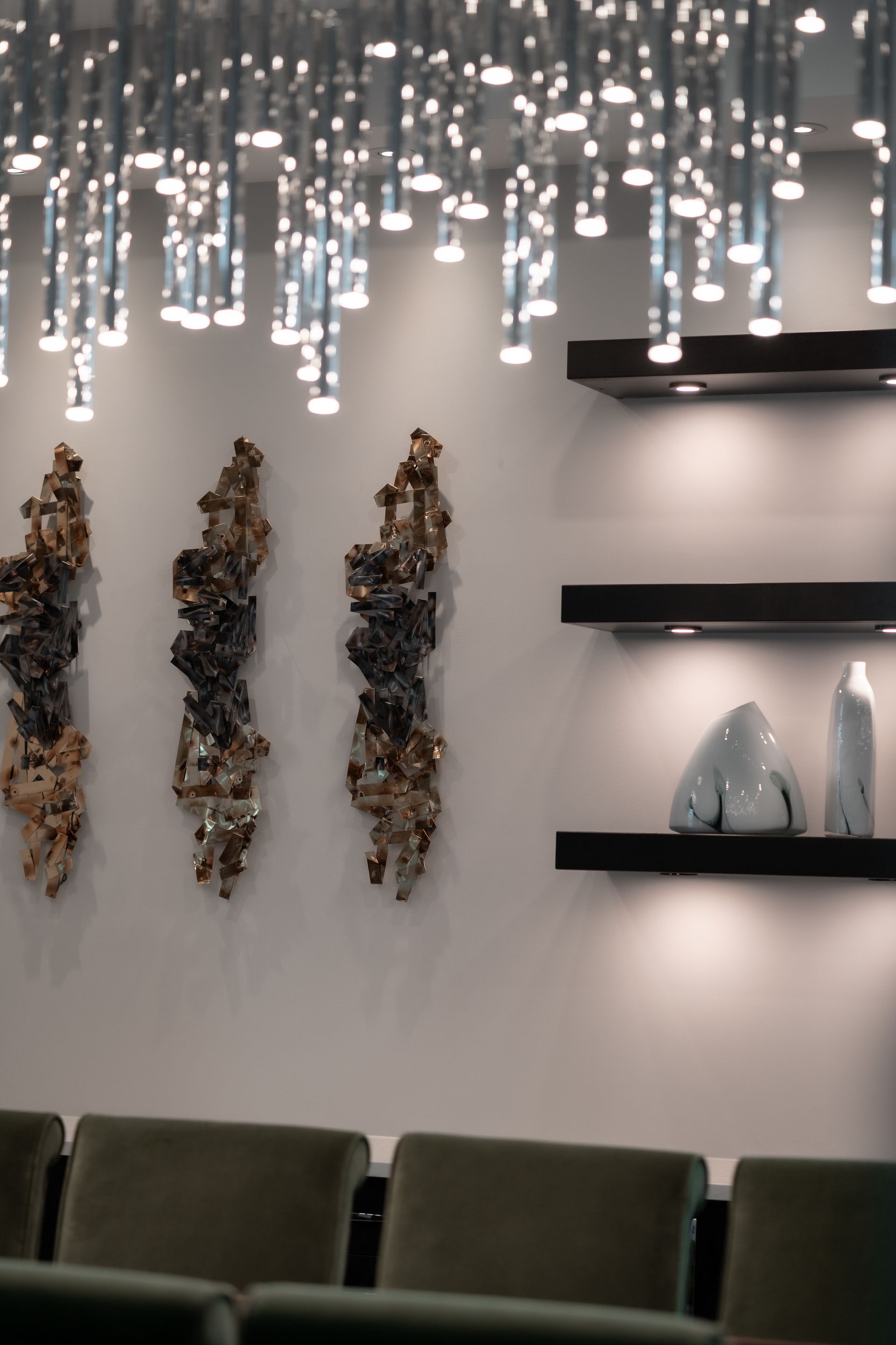 A room with a lot of shelves and sculptures on the wall