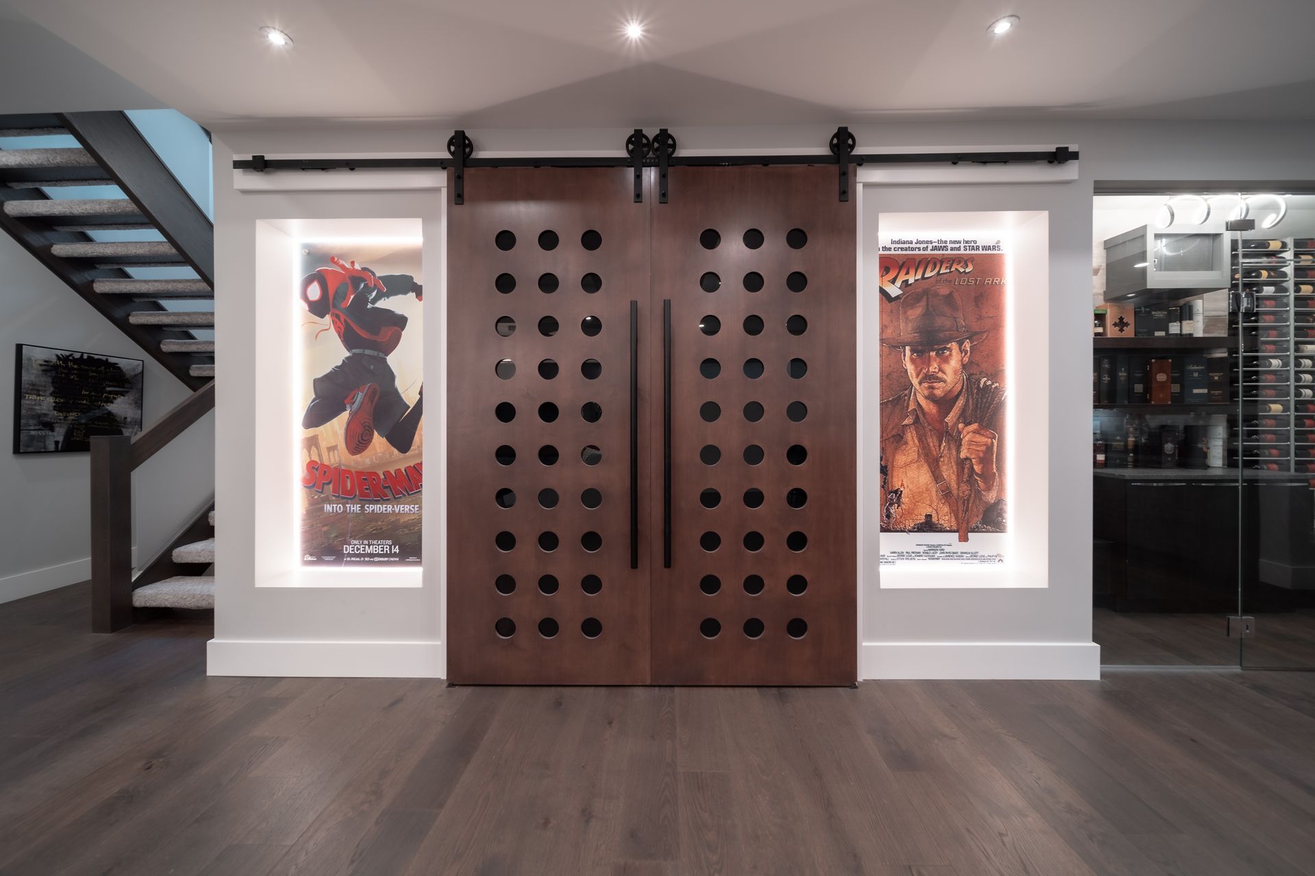 A room with a staircase and a sliding barn door