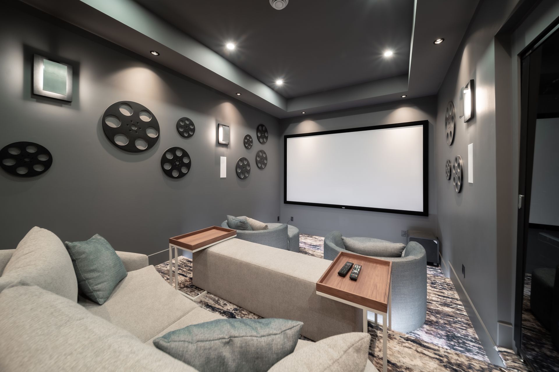 A home theater with a large screen and a couch