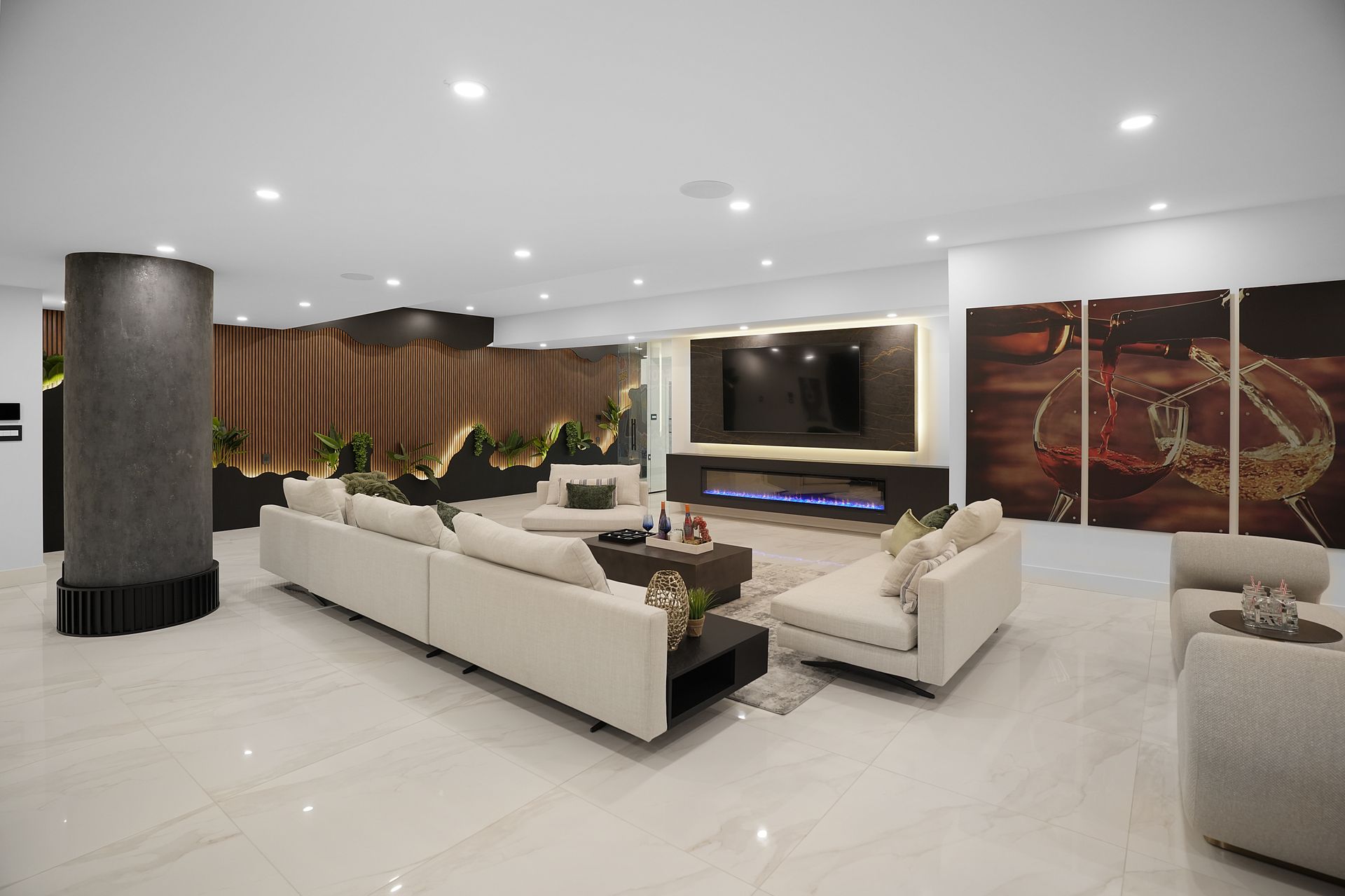 A living room with a couch , chairs , and a television.