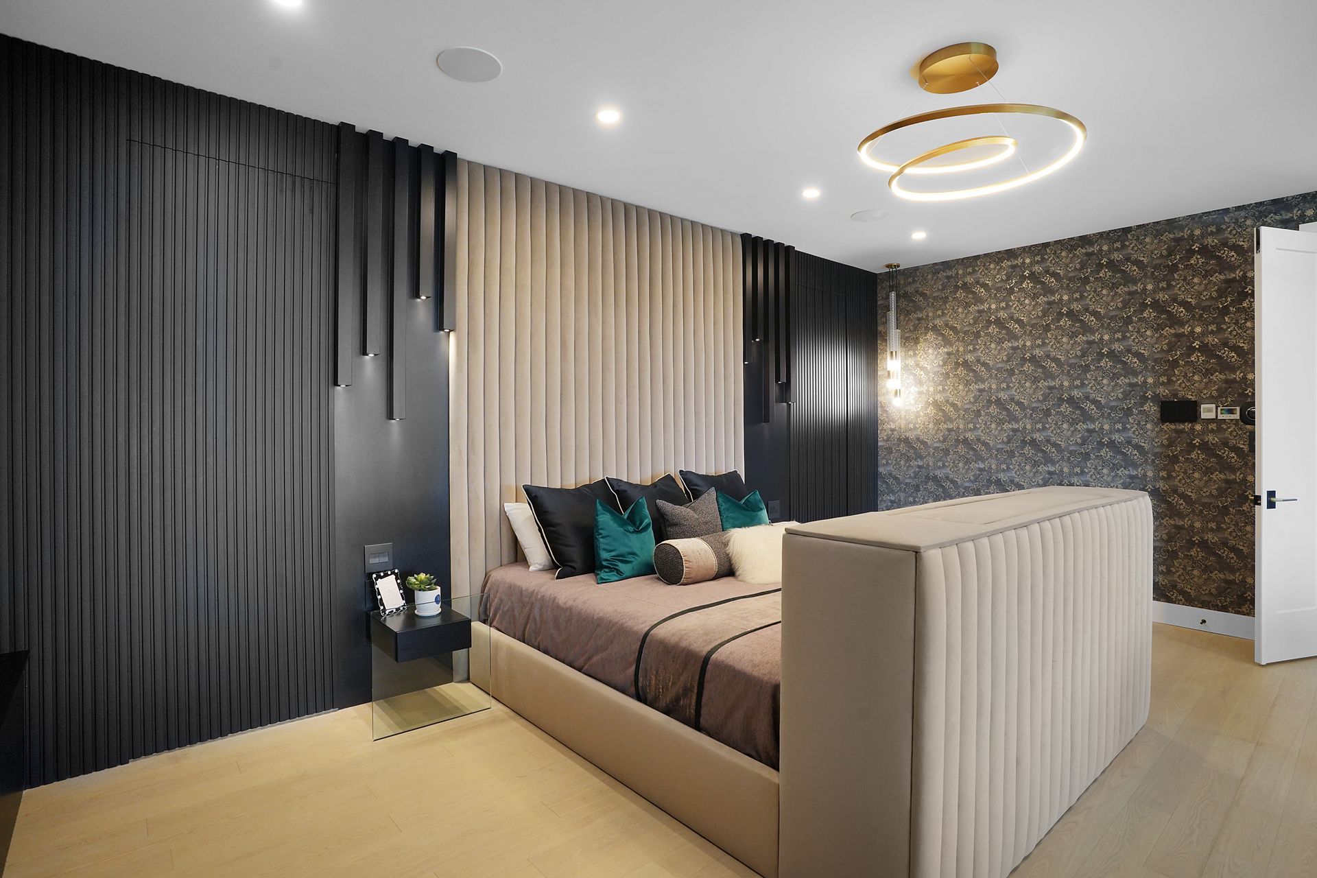 There is a large bed in the middle of the room.