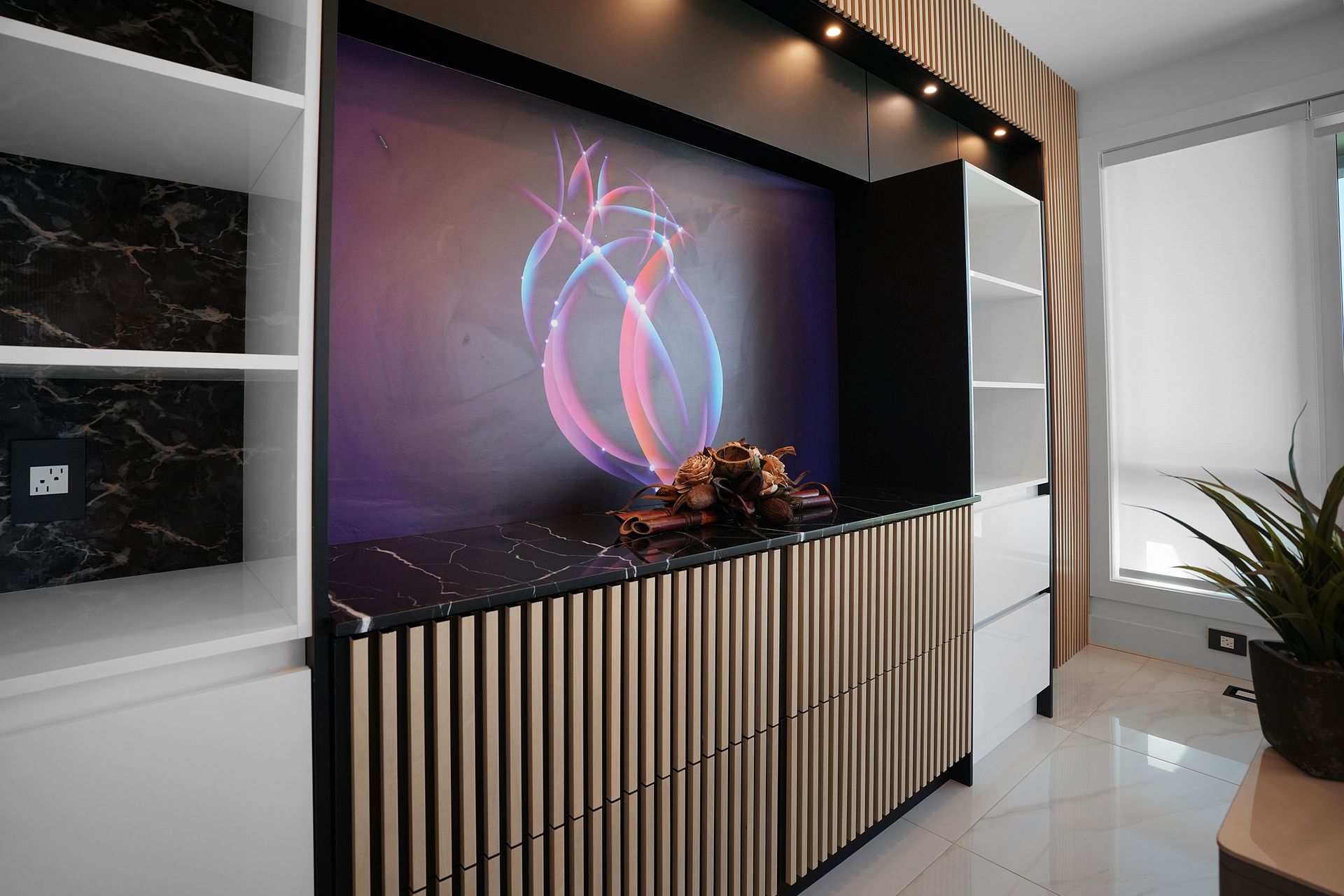 There is a picture of a heart on the wall in the living room.