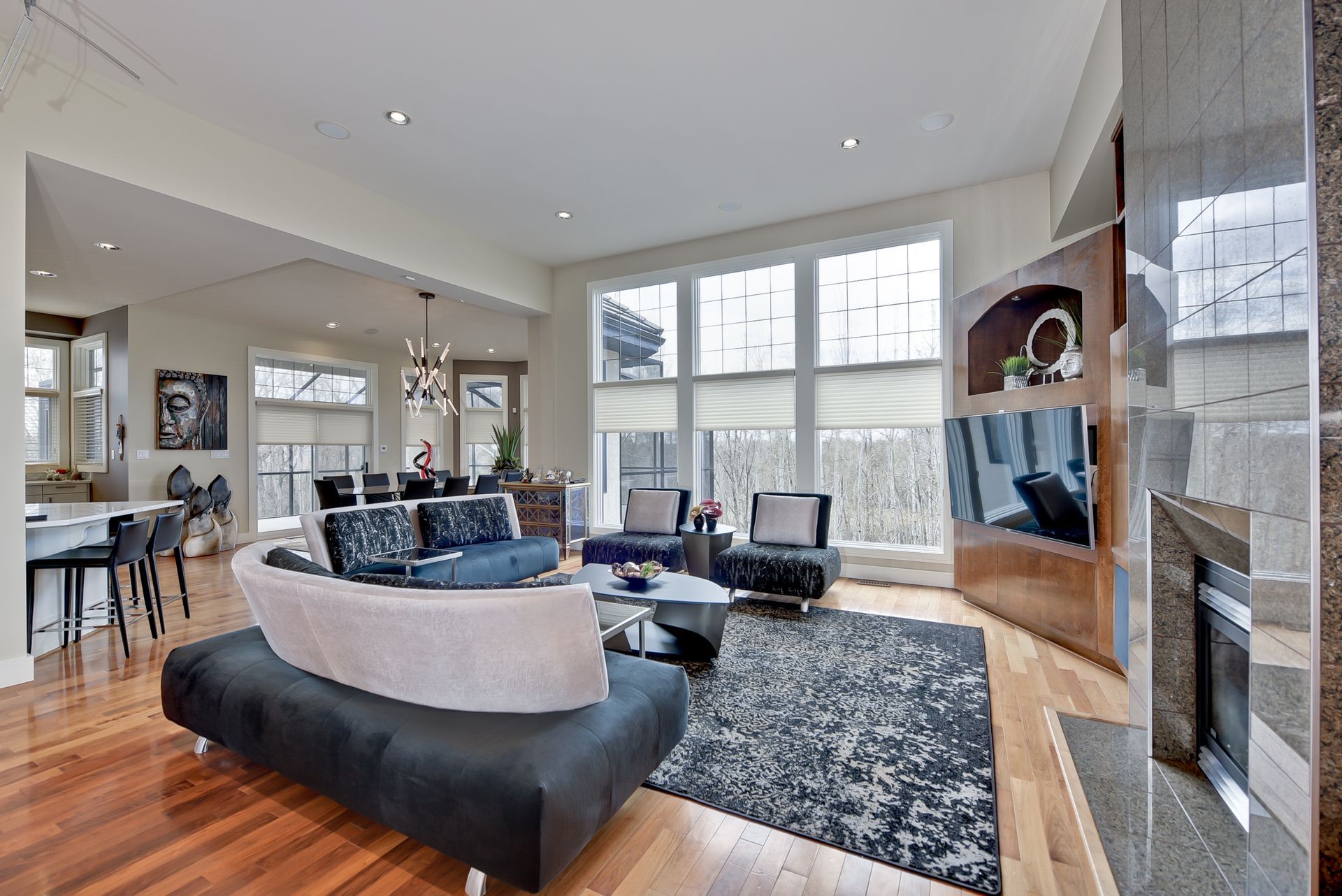 A living room filled with furniture and a fireplace.