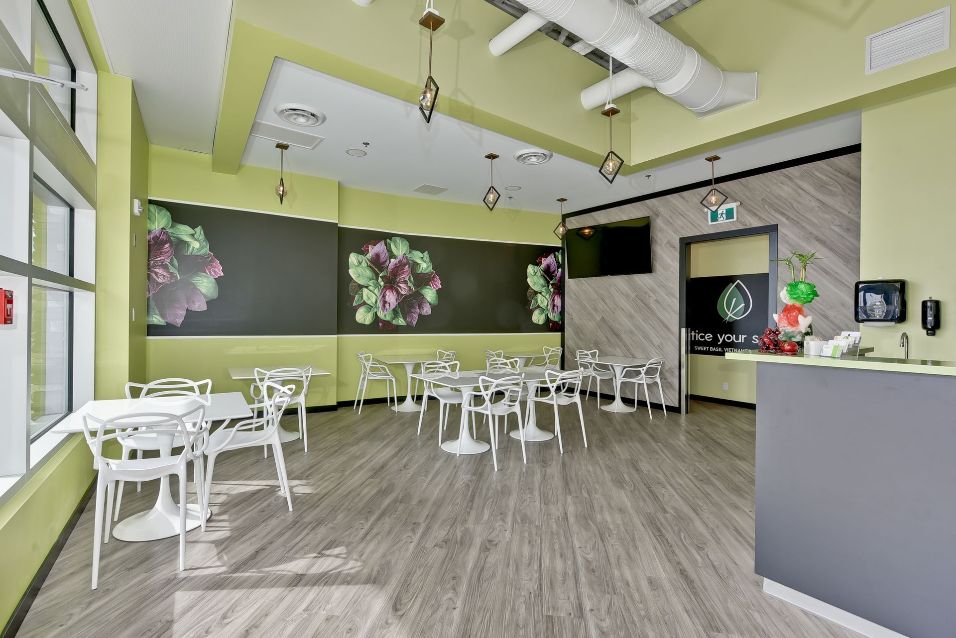 A large room with tables and chairs in it.