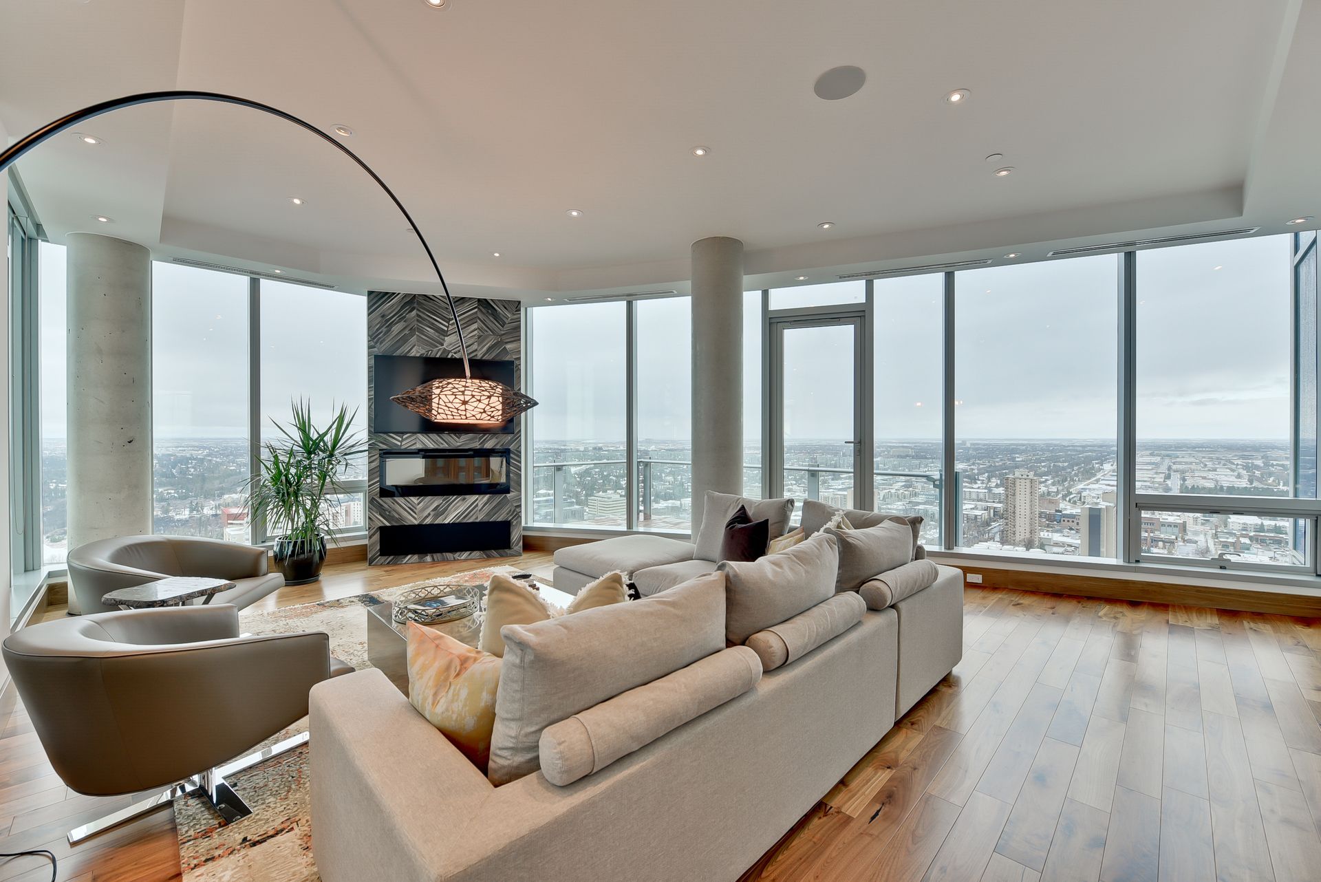 A living room with a lot of windows and a couch