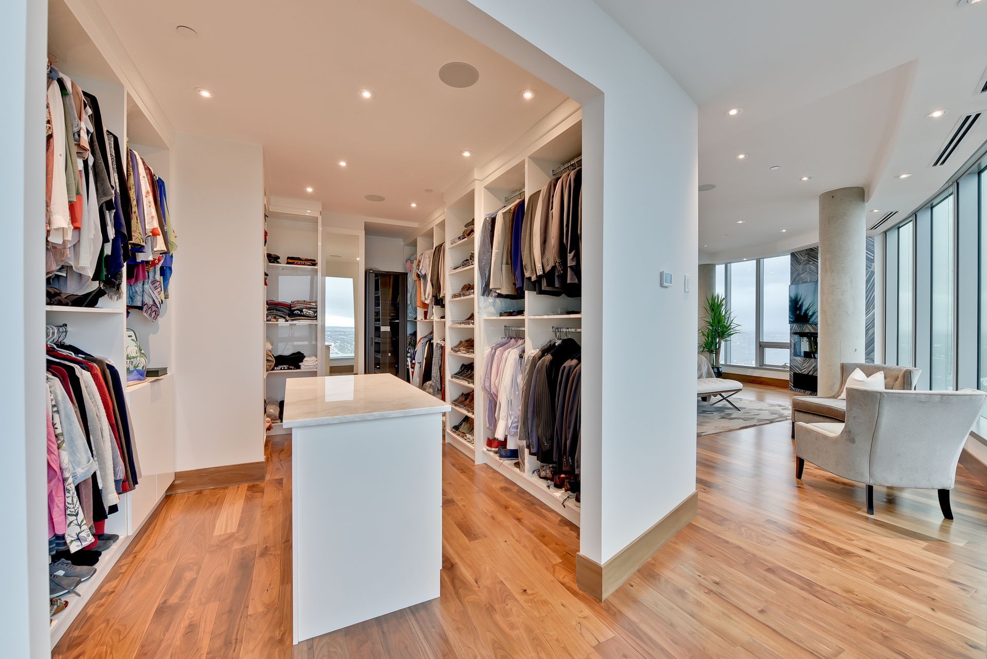 There is a large walk in closet in the middle of the room.