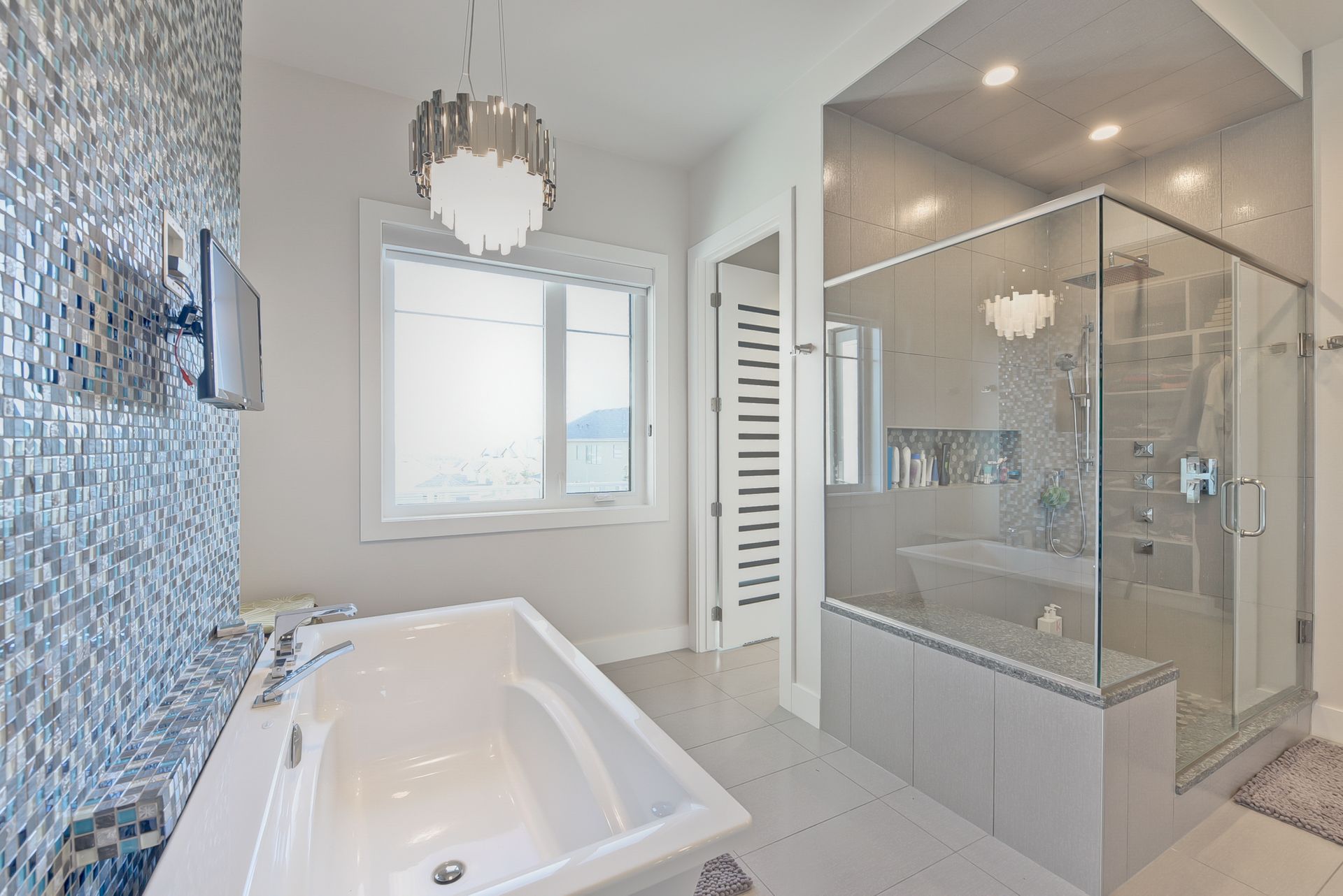 A bathroom with a bathtub and a walk in shower