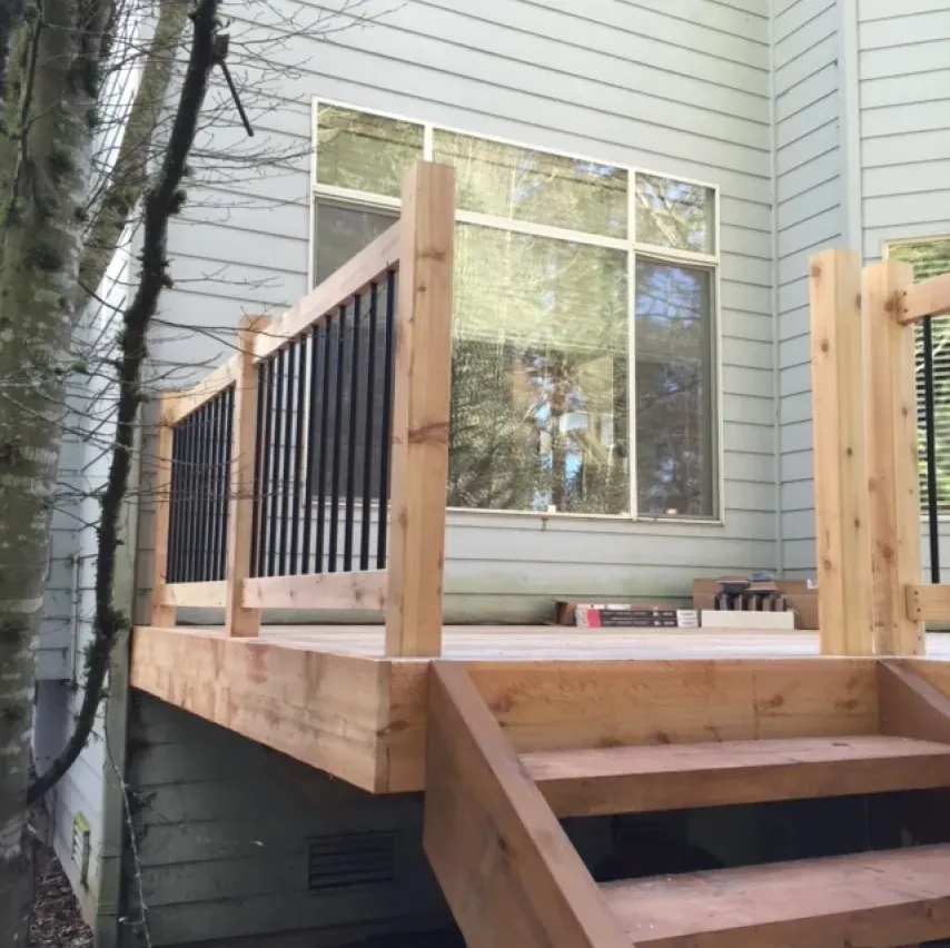A wooden deck with stairs leading up to it