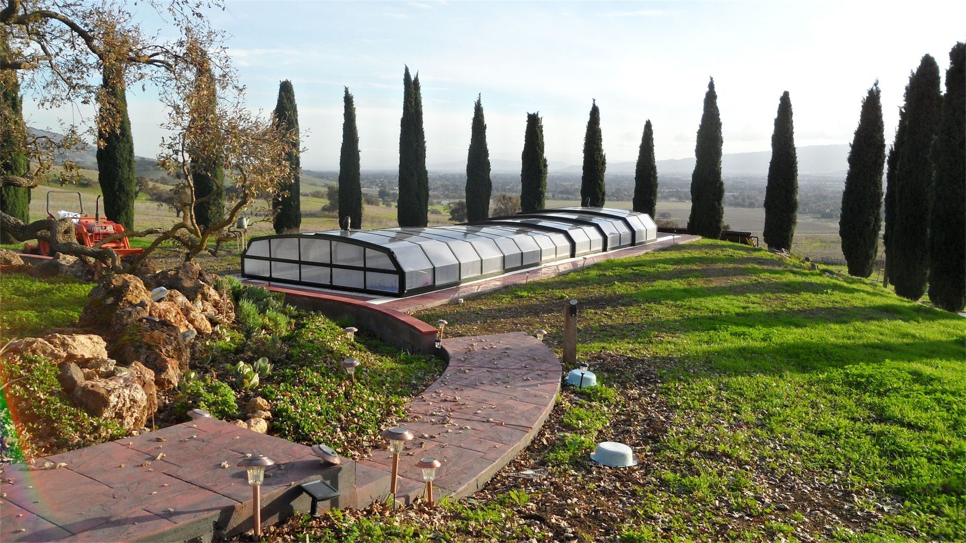 Low profile retractable enclosure doesn't disrupt view