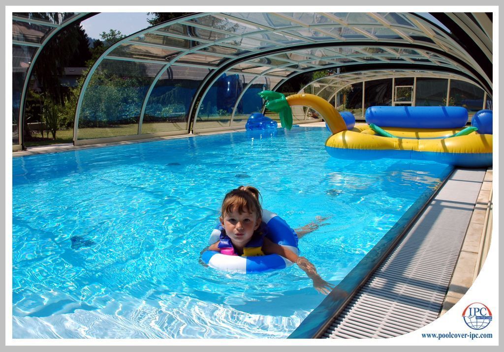 Swimmer inside retractable enclosure