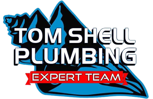 A logo for tom shell plumbing expert team with a mountain in the background.