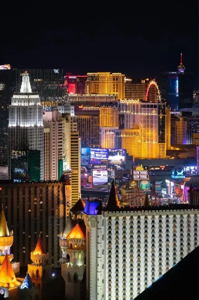 Henderson Artificial Turf-Nighttime panoramic view of the Las Vegas Strip showcasing illuminated casinos, hotels, and the High Roller Ferris wheel.