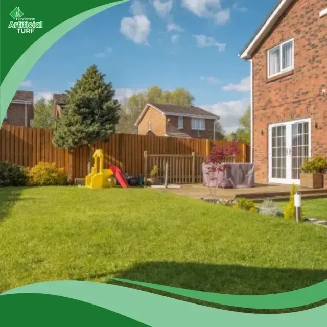 Henderson Artificial Turf - A bright backyard with lush artificial turf, a children's slide, and a brick house.