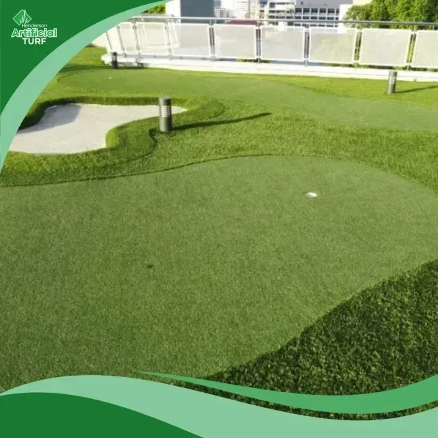 Henderson Artificial Turf - Artificial turf putting green with a sand trap and a golf hole under a bright sky.