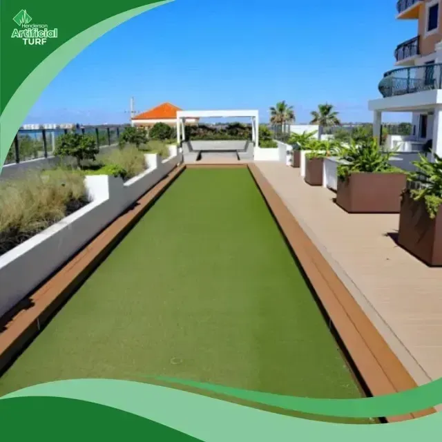 Henderson Artificial Turf - A bocce ball court with artificial turf and wooden decking on a sunny day.