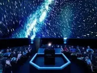 Henderson Artificial Turf - Planetarium with audience viewing starry sky projection.