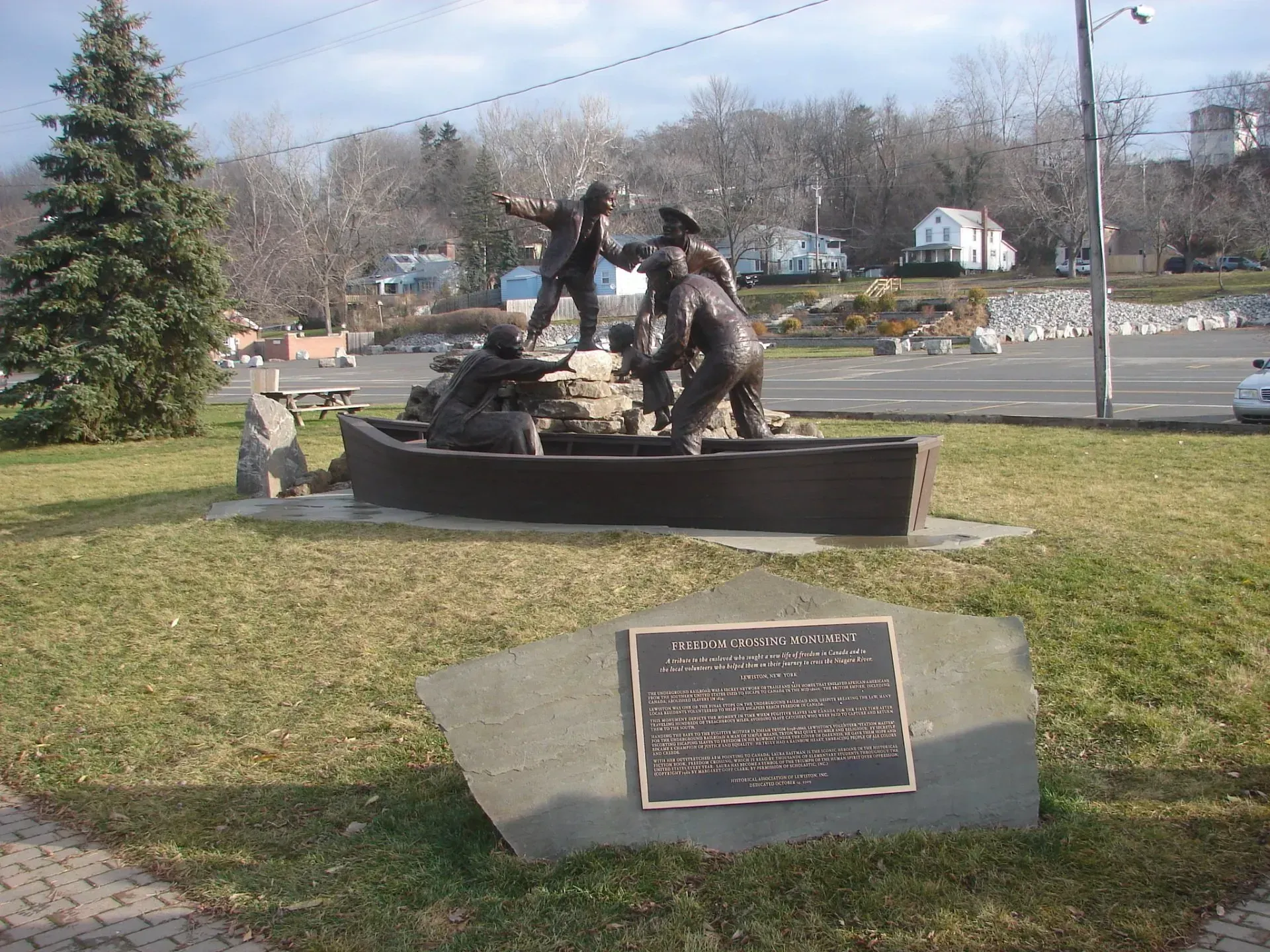 A statue with a plaque that says ' memorial ' on it