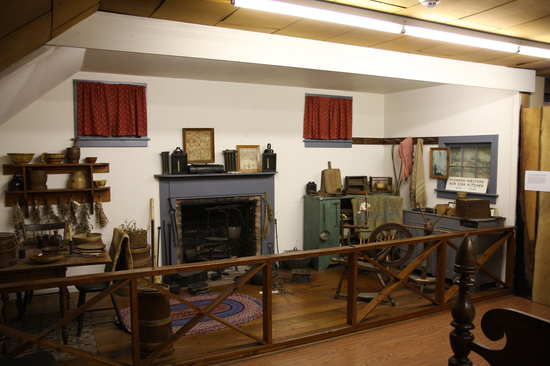 A living room with a fireplace and a wooden fence