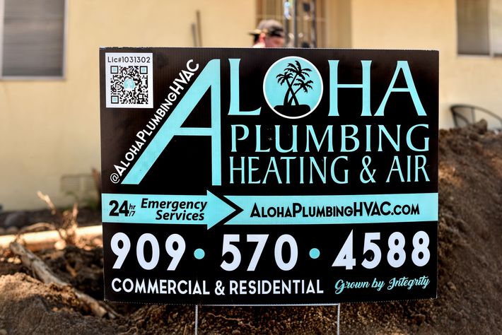 A sign for aloha plumbing heating and air