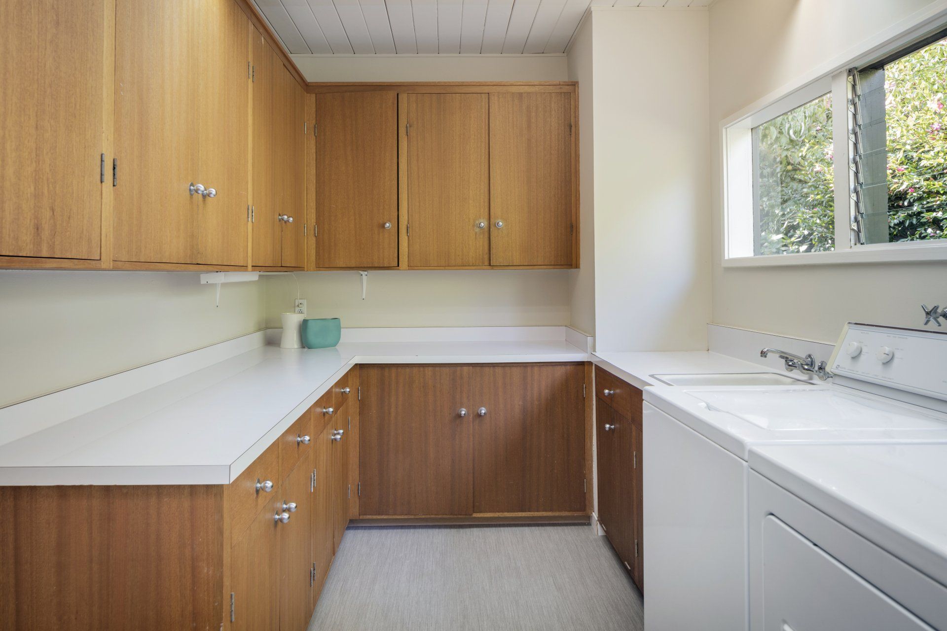 Wood Cabinets In Laundry Room — Absolute Bathrooms & Renovations in Casino, NSW