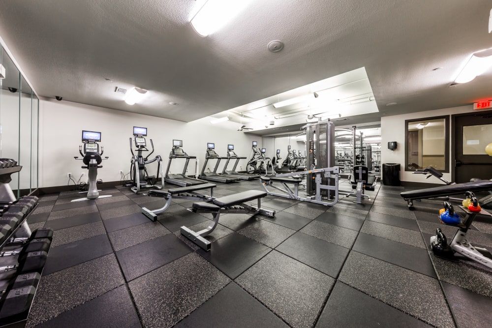 Spacious apartment gym filled with lots of exercise equipment at Regents West at 26th in Austin, TX, near UT Austin.