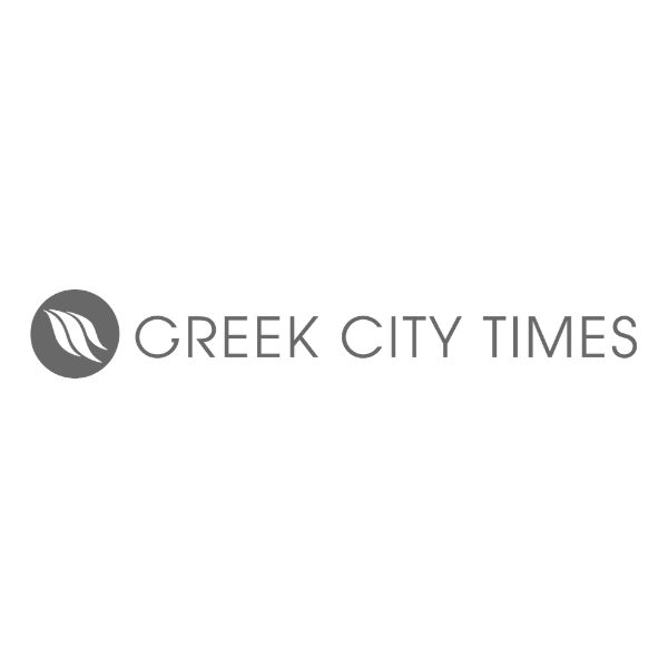 A logo for greek city times with a leaf in a circle.