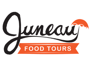 A logo for juneau food tours with a sunset in the background