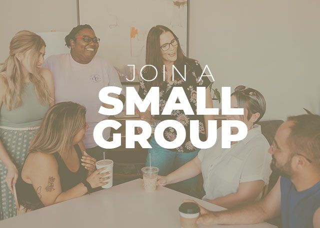 People in a group around a table, text reads 