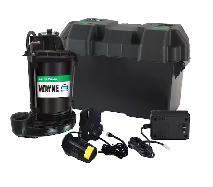 A black wayne drain pump is sitting next to a black box.