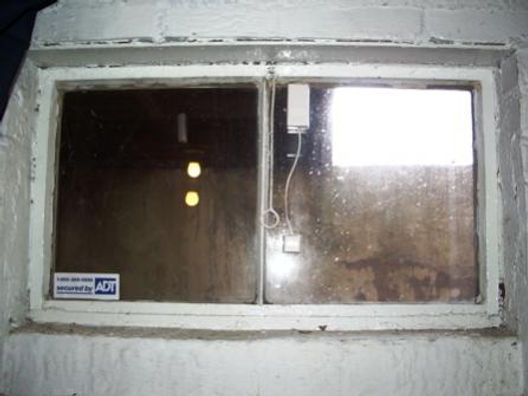 A window with a sticker on it that says acp