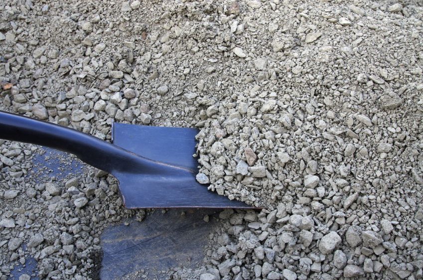 A Shovel Is Sitting On Top Of A Pile Of Gravel — Twin Towns Sand & Gravel In Tweed Heads South, NSW