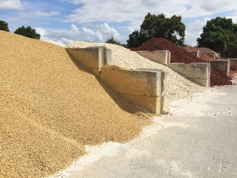 A Pile Of Gravel Sits Next To A Pile Of Sand — Twin Towns Sand & Gravel In Tweed Heads South, NSW