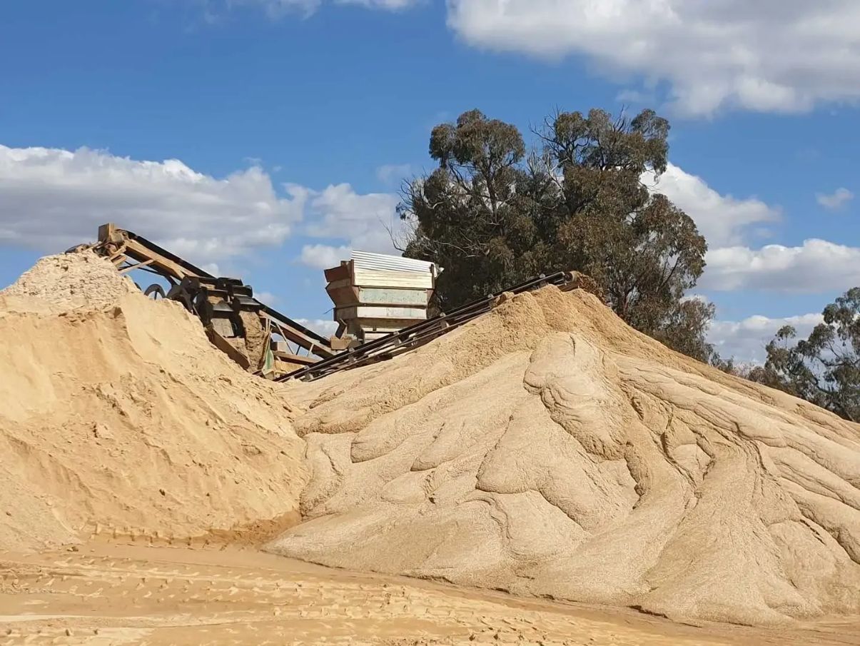 A Large Pile Of Sand With Trees In The Background — Twin Towns Sand & Gravel In Byron Bay, NSW