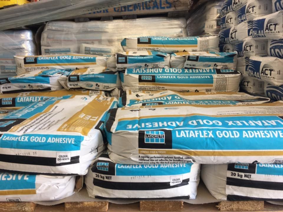 Many Bags Of Lataflex Gold Adhesive Are Stacked On Top Of Each Other — Twin Towns Sand & Gravel In Byron Bay, NSW
